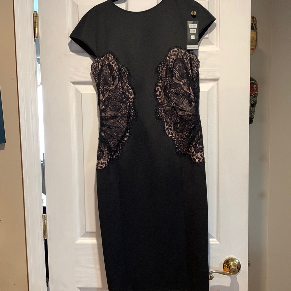 Black dress slightly below knee